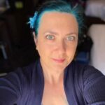 Author photo of Shannon Lawrence with blue hair